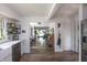 Open layout from kitchen to dining and living areas with hardwood floors and natural light at 5601 Rosslyn Ave, Indianapolis, IN 46220