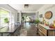 Open-concept dining area and living room filled with natural light and modern decor at 5601 Rosslyn Ave, Indianapolis, IN 46220