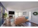 Inviting living room features a fireplace, hardwood floors, and plenty of natural light at 5601 Rosslyn Ave, Indianapolis, IN 46220