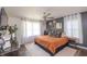 Relaxing main bedroom features a ceiling fan, neutral décor, and a bright window at 5601 Rosslyn Ave, Indianapolis, IN 46220