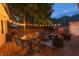 Outdoor patio featuring a stylish seating area with string lights for evening relaxation at 5601 Rosslyn Ave, Indianapolis, IN 46220