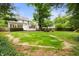 Expansive backyard with lush greenery and mature trees, perfect for outdoor activities and relaxation at 6020 Gladden Dr, Indianapolis, IN 46220