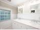 Bathroom featuring dual sinks with marble countertop and vanity with drawers at 6020 Gladden Dr, Indianapolis, IN 46220