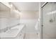 Bright bathroom featuring dual sinks and a glass-enclosed walk-in shower at 6020 Gladden Dr, Indianapolis, IN 46220