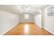 Attic bedroom with hardwood floors, a ceiling fan and a window for natural light at 6020 Gladden Dr, Indianapolis, IN 46220