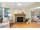 Living room displaying fireplace with stone surround and wood mantle at 6020 Gladden Dr, Indianapolis, IN 46220
