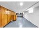 Unfinished basement with sealed concrete floors and paneled walls at 6045 Dewey Ave, Indianapolis, IN 46219