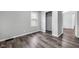 Bedroom features wood-look floors, a window, closet and neutral walls at 6045 Dewey Ave, Indianapolis, IN 46219