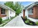 View down concrete driveway between homes with landscaping at 6045 Dewey Ave, Indianapolis, IN 46219