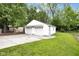 Detached two-car garage exterior with concrete pad and grassy yard at 6045 Dewey Ave, Indianapolis, IN 46219