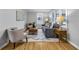 Bright living room with modern decor, hardwood floors, and plenty of natural light at 6045 Dewey Ave, Indianapolis, IN 46219