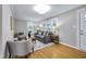 Cozy living room with hardwood floors, neutral color scheme, and comfortable seating arrangements at 6045 Dewey Ave, Indianapolis, IN 46219