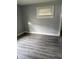 Cozy bedroom featuring gray walls and new vinyl floors at 701 N Gladstone Ave, Indianapolis, IN 46201