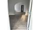 Spacious room showcasing vinyl floors, arched doorway and fresh paint at 701 N Gladstone Ave, Indianapolis, IN 46201