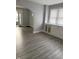 Inviting living room features new vinyl floors and neutral paint at 701 N Gladstone Ave, Indianapolis, IN 46201