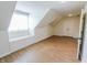 Attic space with sloped ceilings, vinyl flooring, recessed lights, and built-in seating at 7093 Republic Ln, Indianapolis, IN 46259