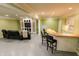 Spacious finished basement featuring a bar area, entertainment setup and recessed lighting at 7093 Republic Ln, Indianapolis, IN 46259