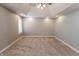 Large bedroom with carpet, a tray ceiling and ceiling fan, recessed lighting, and window shutters at 7093 Republic Ln, Indianapolis, IN 46259