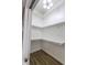 Walk-in closet featuring built-in shelves and clothes racks, and laminate flooring at 7093 Republic Ln, Indianapolis, IN 46259