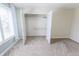 Bedroom closet with double doors and built in shelving at 7093 Republic Ln, Indianapolis, IN 46259
