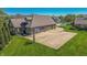 Aerial view of brick home with a basketball court and three car garage at 7093 Republic Ln, Indianapolis, IN 46259