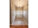 Bright foyer featuring tile flooring and a stylish chandelier above at 7093 Republic Ln, Indianapolis, IN 46259