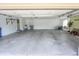 Spacious garage with ample room for parking and storage and white walls at 7093 Republic Ln, Indianapolis, IN 46259