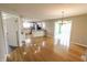 Open-concept dining area flowing into a modern kitchen with updated appliances at 7093 Republic Ln, Indianapolis, IN 46259