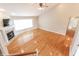 Bright living area featuring hardwood flooring, fireplace, and vaulted ceiling at 7093 Republic Ln, Indianapolis, IN 46259