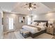 The main bedroom boasts a tray ceiling, ample natural light, and a cozy sitting area at 7093 Republic Ln, Indianapolis, IN 46259