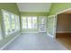 Inviting sunroom with a tile floor, multiple windows, and easy access to the outdoors at 7093 Republic Ln, Indianapolis, IN 46259