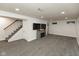 Finished basement with gray carpet, fireplace, and entertainment area at 713 Colonial Way, Greenwood, IN 46142