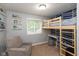 Charming bedroom featuring a bunk bed, desk area, and a bright window for natural light at 713 Colonial Way, Greenwood, IN 46142
