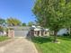 Well-manicured front lawn and trees complement the charming two-story home at 713 Colonial Way, Greenwood, IN 46142