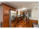 Spacious kitchen featuring stainless steel appliances, custom cabinetry, and beautiful countertops and hardwood floors at 713 Colonial Way, Greenwood, IN 46142