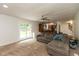 Bright living room featuring sliding glass doors to the backyard, neutral paint, and an open layout at 713 Colonial Way, Greenwood, IN 46142