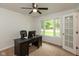 Bright home office with large window, ceiling fan, neutral carpet, and office furniture at 713 Colonial Way, Greenwood, IN 46142