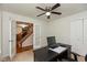 Bright home office with ceiling fan, neutral carpet and ample closet space at 713 Colonial Way, Greenwood, IN 46142
