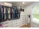 Spacious walk-in closet with custom shelves, drawers, and ample storage at 713 Colonial Way, Greenwood, IN 46142