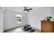 Bright bedroom with ceiling fan, neutral carpet, and exterior view from a large window at 7226 Sayers Rd, Indianapolis, IN 46259
