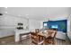 Open concept dining area adjacent to the kitchen and living room with neutral wall paint at 7226 Sayers Rd, Indianapolis, IN 46259
