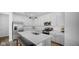 Modern kitchen with white cabinets, stainless steel appliances, and a large island at 7226 Sayers Rd, Indianapolis, IN 46259