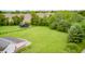 Expansive lot with a detached garage and plenty of green space, surrounded by lush trees and fields at 7333 State Road 42, Martinsville, IN 46151