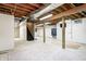 Unfinished basement featuring exposed beams and concrete walls at 7333 State Road 42, Martinsville, IN 46151