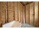 Unfinished basement area with exposed wood framing, plumbing, and a utility sink, offering a customizable space at 7333 State Road 42, Martinsville, IN 46151