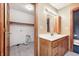 Bathroom vanity and sink adjacent to a laundry room or storage area at 7333 State Road 42, Martinsville, IN 46151