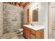 Basement bathroom with vanity, mirror, and concrete block wall at 7333 State Road 42, Martinsville, IN 46151