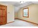 Attic bedroom featuring beige carpet, cream colored walls, and sloped ceiling at 7333 State Road 42, Martinsville, IN 46151