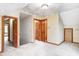 Bright, carpeted bedroom with paneled doors and natural wood trim at 7333 State Road 42, Martinsville, IN 46151