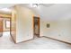 Brightly lit bedroom with carpet and paneled door at 7333 State Road 42, Martinsville, IN 46151